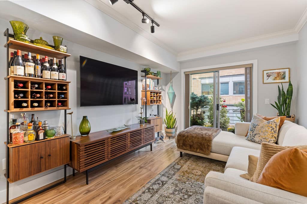 Interior living room remodel with built in storage and wood flooring