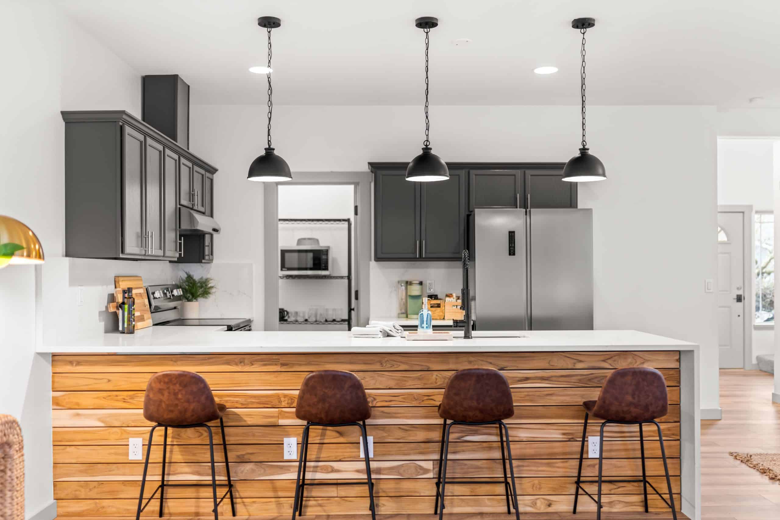 Kitchen renovation with countertops backsplash and lighting